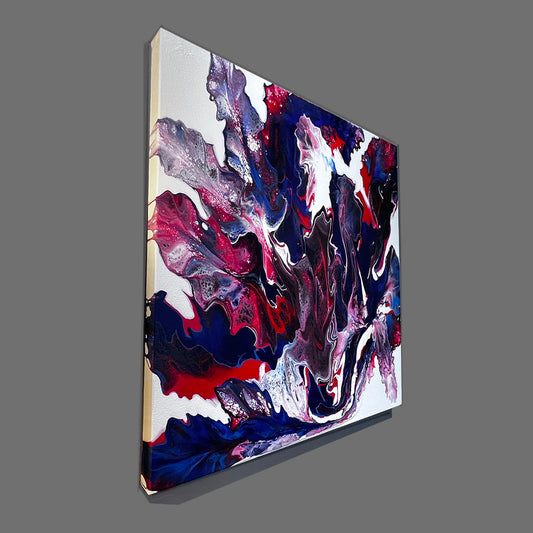 Abstract canvas wall art featuring swirling fluid paint patterns in navy, red, purple, black, and white, shown at an angle against a solid gray background.