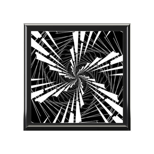Framed abstract art with black and white geometric design on a white background