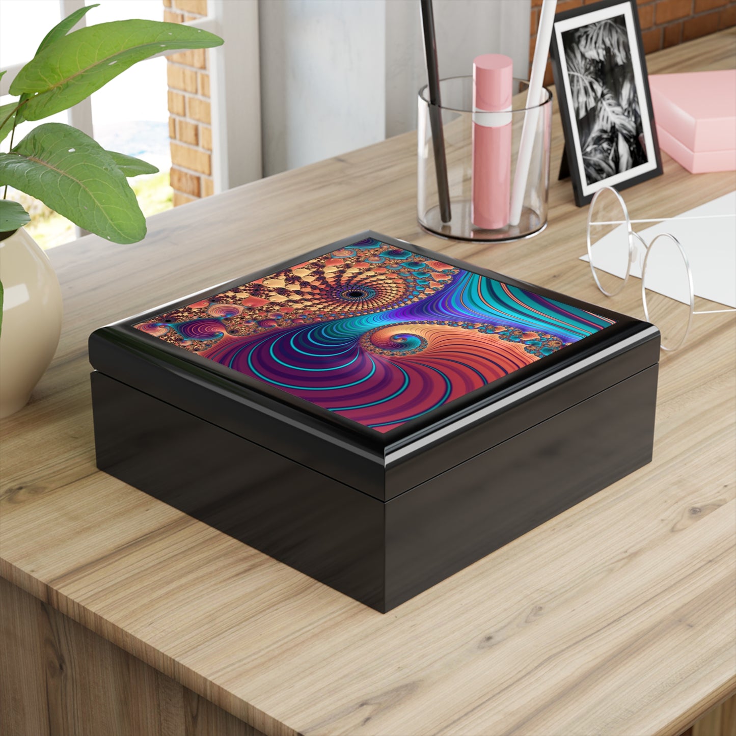 Decorative box with a colorful spiral design on a wooden surface