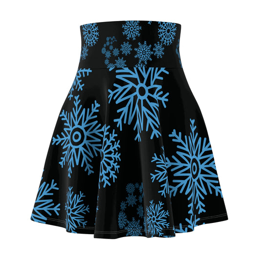 A black flared skirt with a high waistband, featuring a vibrant blue snowflake pattern of varying sizes, shown against a plain white background.