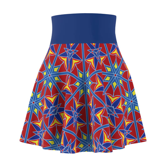 A high-waisted skater skirt with a solid royal blue waistband and a vibrant red, blue, and yellow geometric star pattern on the flared skirt.