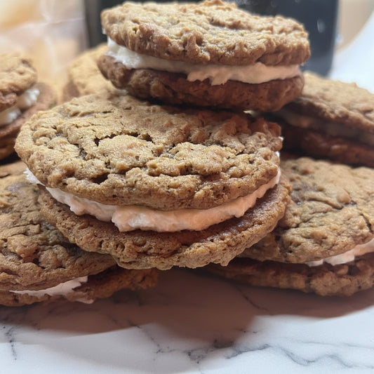 Stack of oatmeal cream pies on a white plate