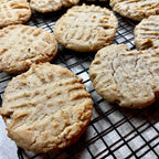 Cookies on a cooling rack with a light background