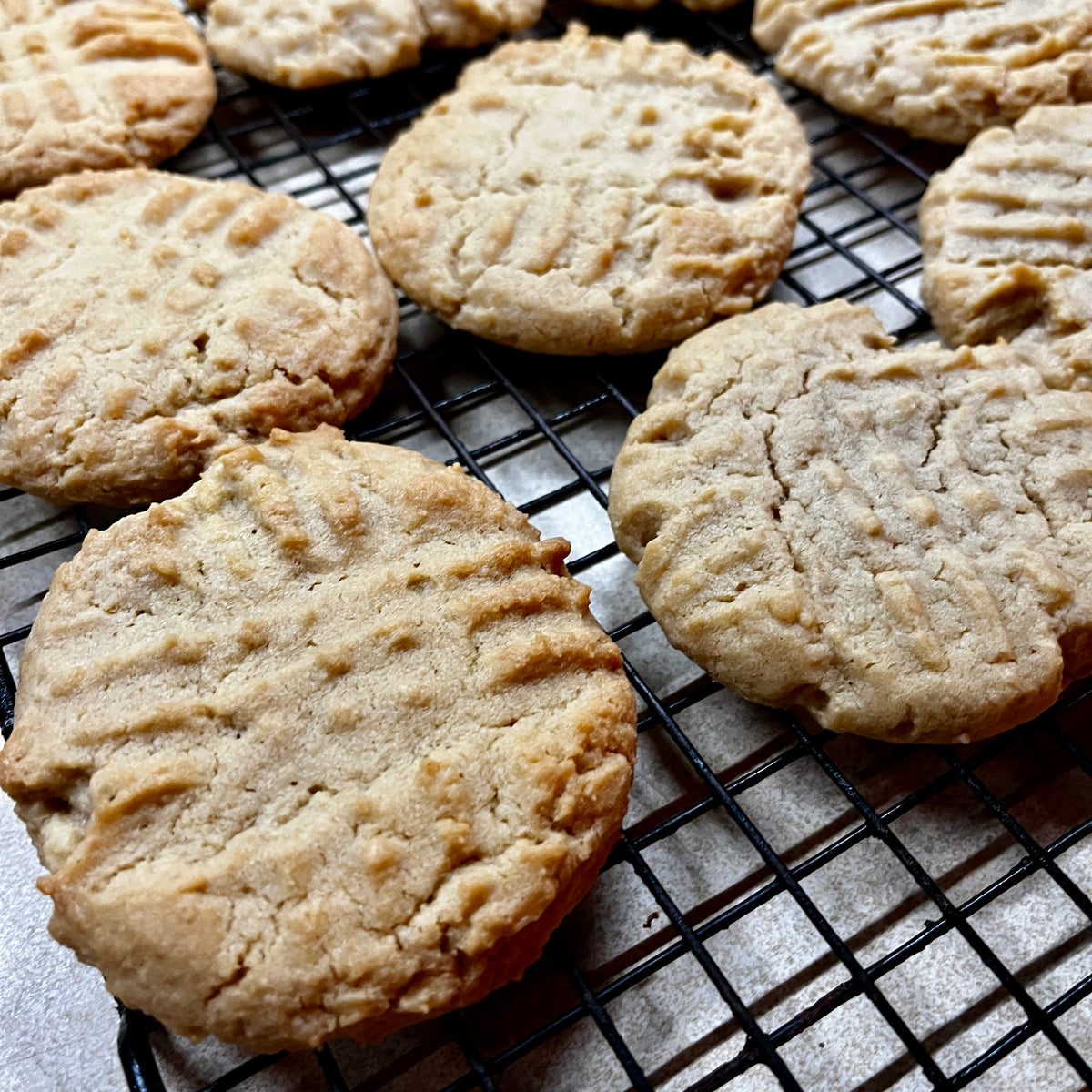 Cookies on a cooling rack with a light background