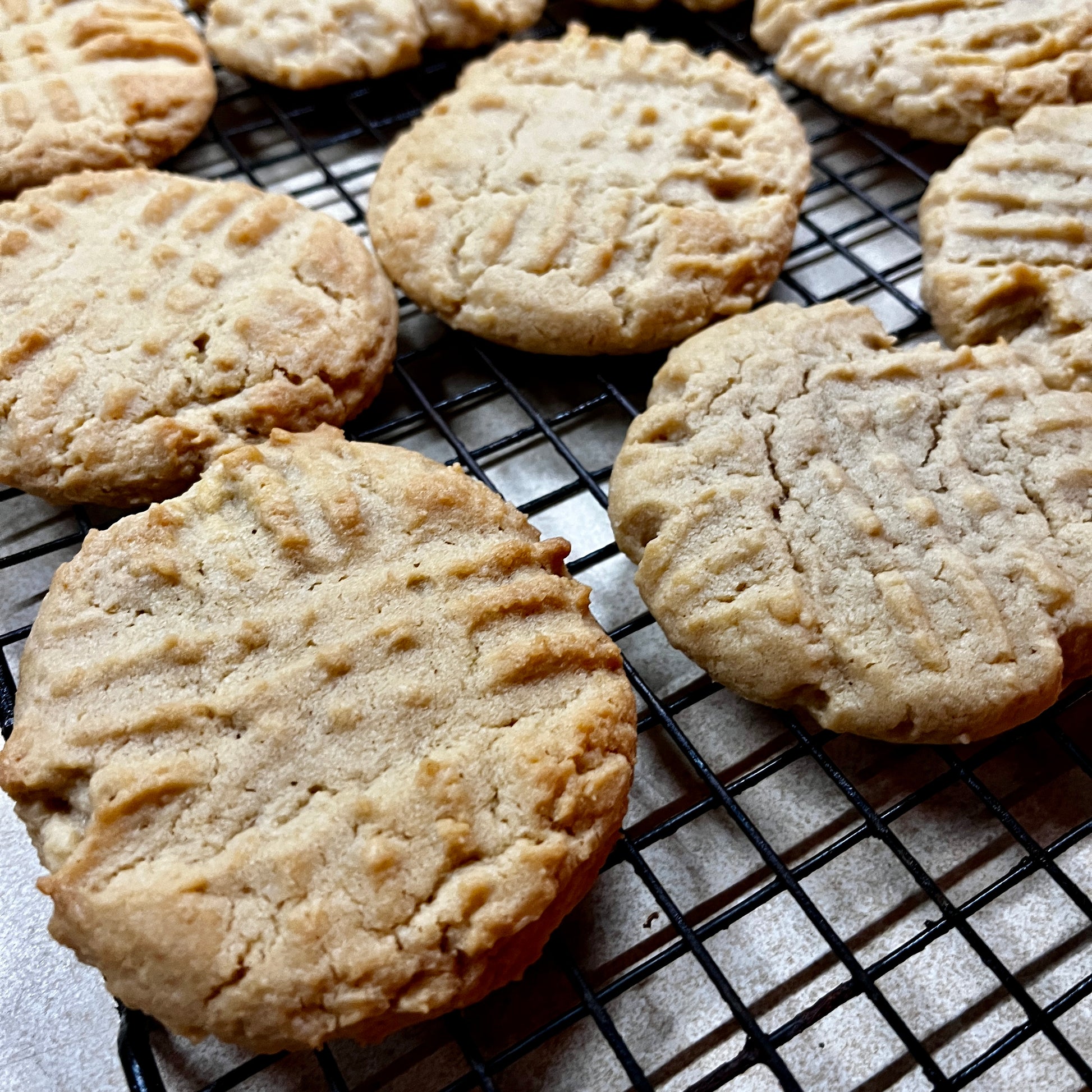 Cookies on a cooling rack with a light background