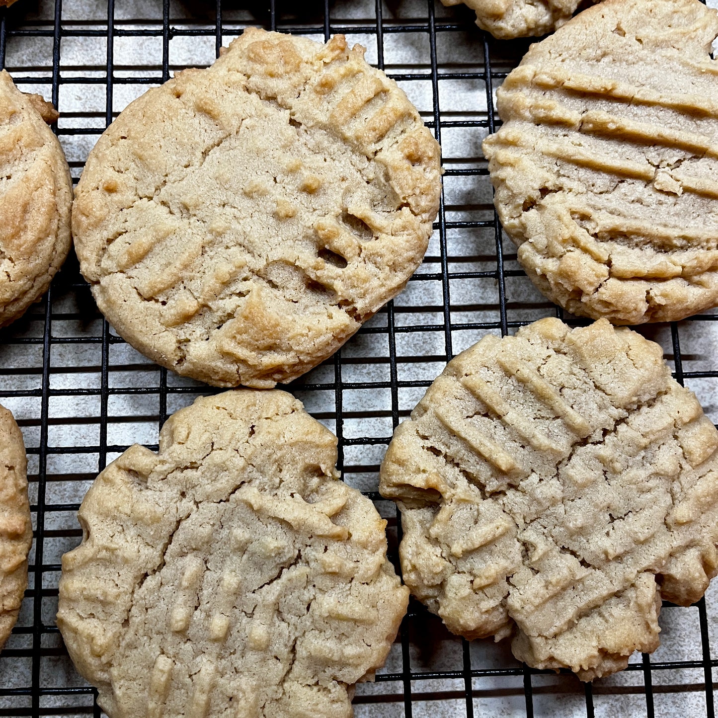 Peanut butter cookies on a cooling rack