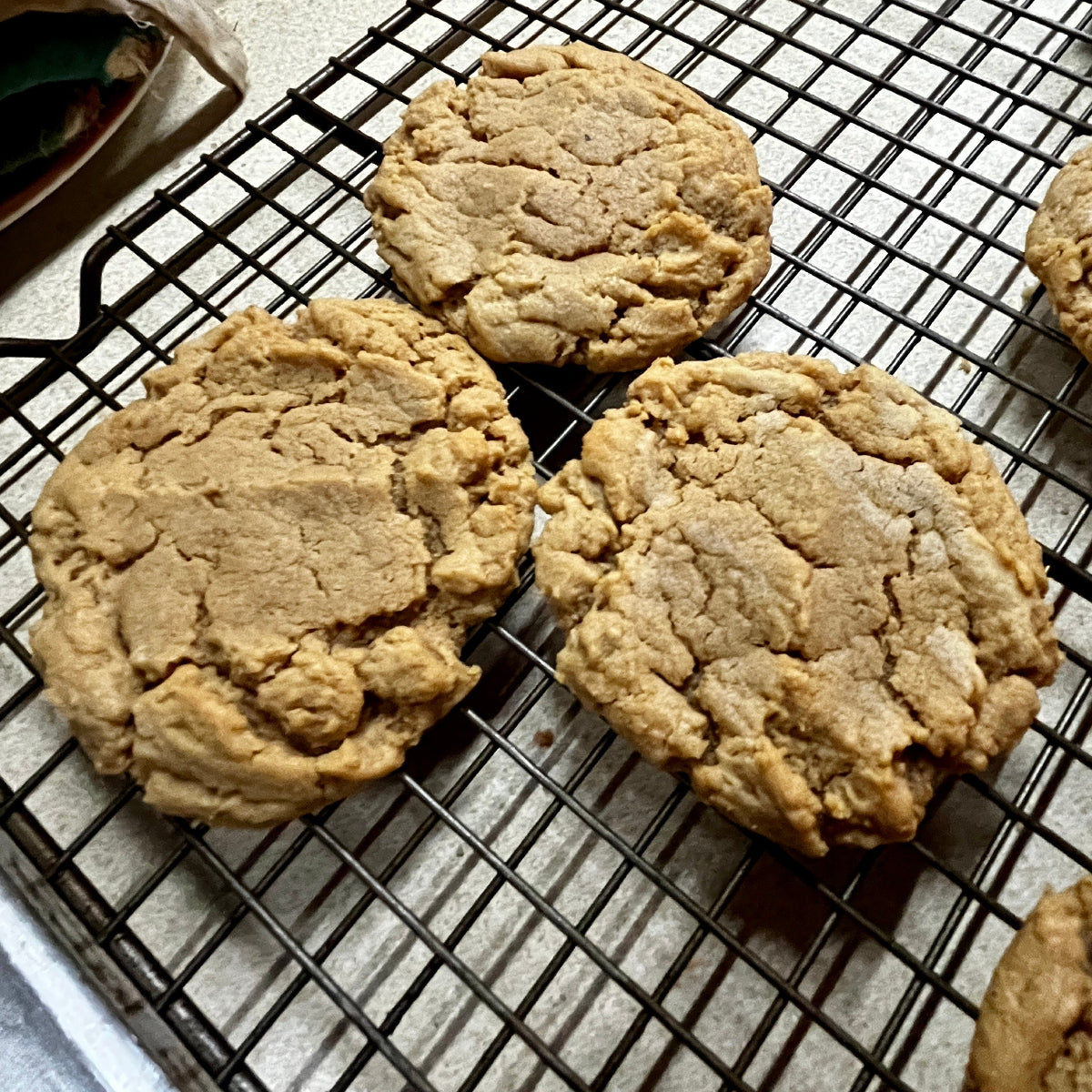 Cookies on a cooling rack with a light background