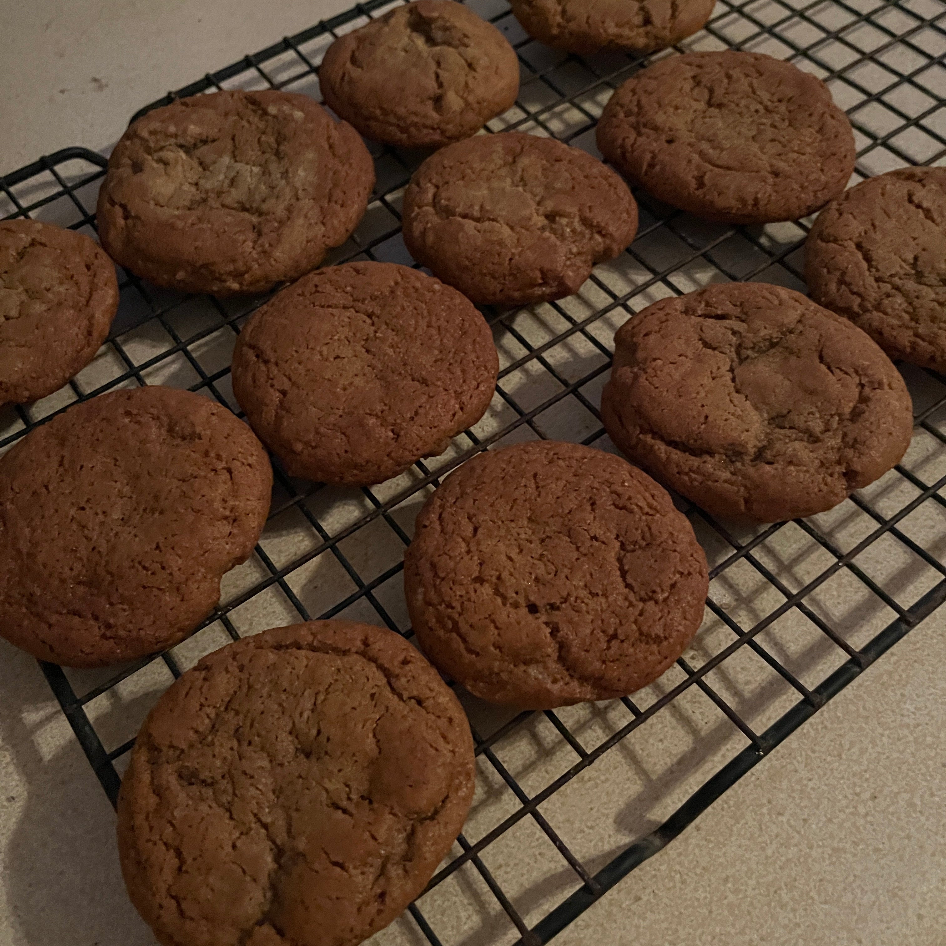 Brown cookies on a cooling rack